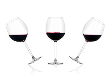 Three glasses of red wine half filled isolated on white background.