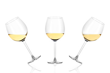 Three glasses of white wine half filled isolated on white background.