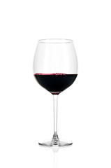 A glass of red wine half filled, isolated on a white background.