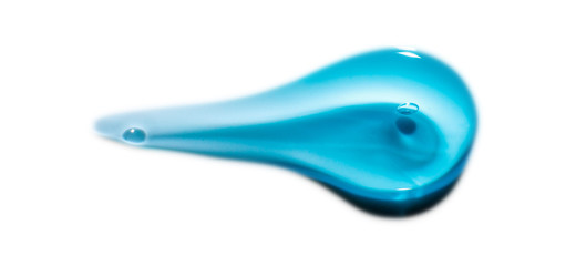 Squeezed cosmetic clear cream gel texture Iisolated on white background. Close up photo of transparent drop of skin care product. High Quality transparent gel serum with bubbles on white background