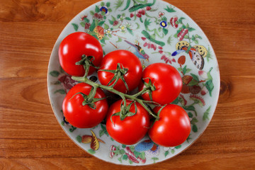 Vine tomatoes on an antique plate