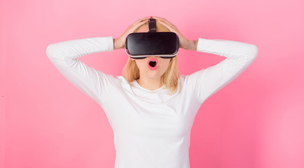 Funny woman experiencing 3D gadget technology - close up. Excited smiling businesswoman wearing...