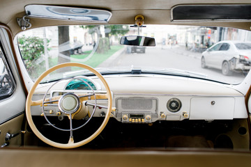 Driver's cockpit of a classic car. Old car interior 