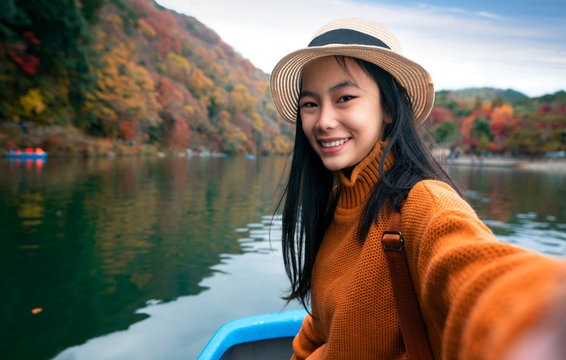 Japanese girl on the boat in arashiyam