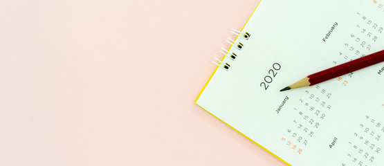 close up top view on  calendar 2020 month schedule to make appointment meeting or manage timetable...