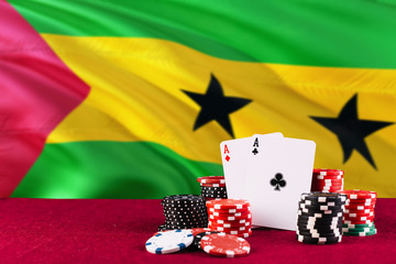 Sao Tome And Principe casino theme. Aces in poker game, cards and chips on red table with national...