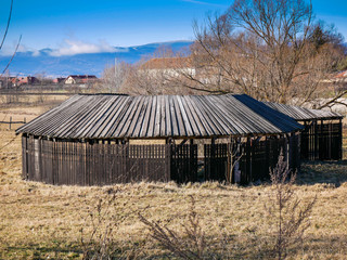Old, traditional hungarian wooden bath house in Transylvania, Romania at winter .