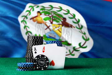 Belize casino theme. Two ace in poker game, cards and black chips on green table with national flag background. Gambling and betting.