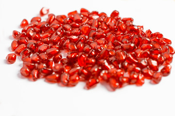 Grain pomegranate on a white background, beautiful texture.