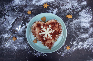 tasty homemade christmas cheesecake on a black background