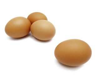 Raw fresh brown chicken eggs isolated on white background.