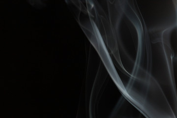 white smoke on a black background