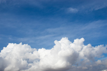 Naklejka na ściany i meble Blue sky background with big fluffy clouds