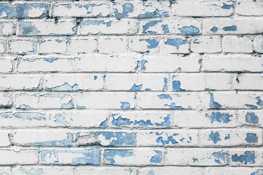 Fototapeta Blue and white brick wall texture background. Old weathered and cracked bricks close up. Copy space