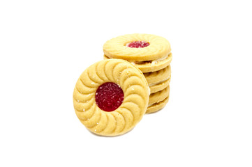 Biscuit sandwich butter cookies with cream and strawberry flavoured jam. A stack of crunchy delicious sweet meal and useful cracker. isolated on white background. Soft focus.