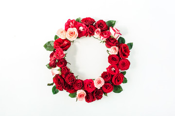 Round frame border of pink, red rose flowers on white background. Mockup blank copy space. Flat...
