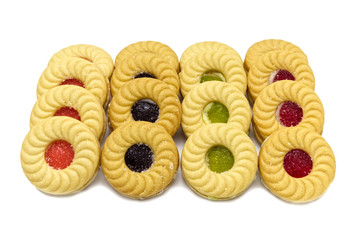 Biscuit sandwich butter cookies with cream and mixed fruits flavoured jam. A stack of crunchy delicious sweet meal and useful cracker. isolated on white background. Soft focus.