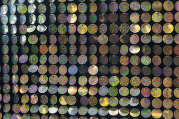Beautiful background of colorful shiny plates. Disco