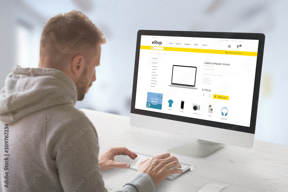 Poster guy shopping online on desktop computer. modern online market web site with technology products and 