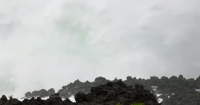 Storm Surge Waves Crash Onto Rocky Coastline - Vong