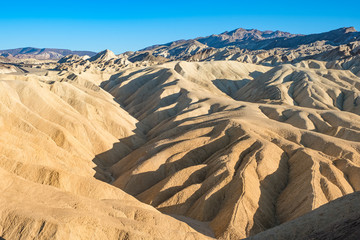 Fototapeta na wymiar Zabriski Point Mudstones form Badlands Death Valley National Park California