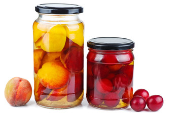 Fototapeta na wymiar Peach slices and cherry plums canned in glass jar isolated on white background
