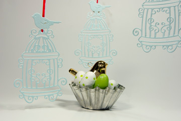 basket with Easter eggs and a bird