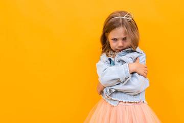 Pretty caucasian girl gesticulates isolated on yellow background