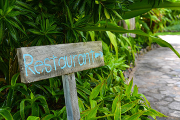 Wooden sign board at garden