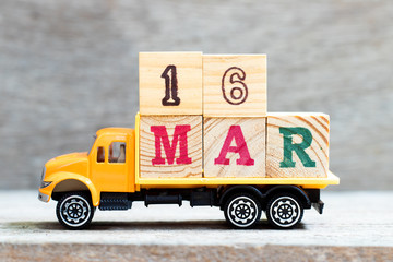 Truck hold letter block in word 16mar on wood background (Concept for date 16 month March)