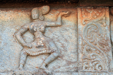 Dancing girl and beautiful design Carved in the stone, on the wall of Mahanavami dibba, Hampi , INDIA