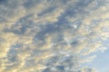 Striped clouds isolated against blue skies