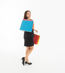 Fototapeta premium Women dressed in skirts and T-shirts and waistcoats Wear shoes Carrying a colorful bag She felt very happy to have a shopping. Shot on a white background