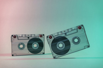 Beautiful Audio cassette tape in neon  light.Minimalism retro style concept. 80s. Background...