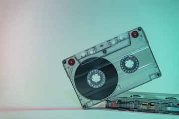 Beautiful Audio cassette tape in neon  light.Minimalism retro style concept. 80s. Background...