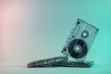 Close up Beautiful Audio cassette tape in neon  light.Minimalism retro style concept. 80s....