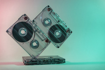 Close up Beautiful Audio cassette tape in neon  light.Minimalism retro style concept. 80s....