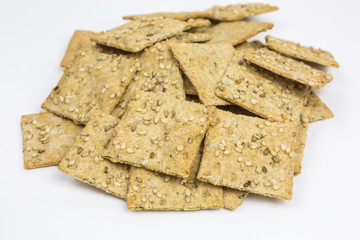 heap of crispy spelt and chickpea cracker with sesame