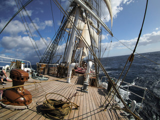 open ocean sailing on a squarerigger tallship sailing vessel, unique perspective © flyingwalrus