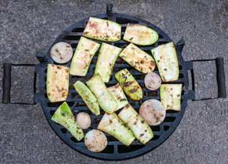 Vegetables are baked on the barbecue.Outdoor food preparation. Charcoal grill. - 309775238