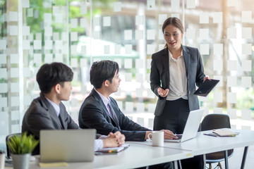 Young asian business group with the creative work, talk and exchange ideas shared at the meeting.