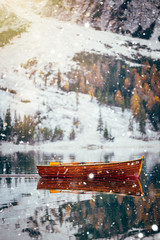 Obraz na płótnie Canvas Braies lake in winter time with snowfall.