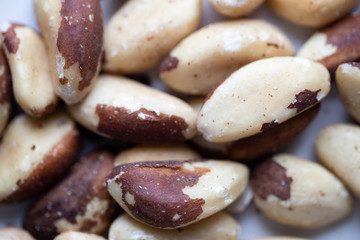 Brazil nuts on white marble background