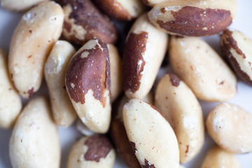 Brazil nuts on white marble background