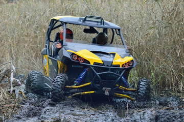 Amazing UTV driving in mud and water at Autumn day. ATV/UTV/4x4 off-road © Antonio