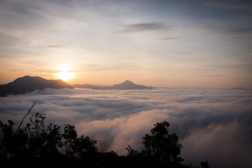 Mountain with white mist in morning sunrise, nature landscape