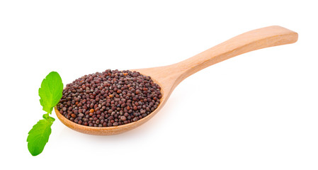 Brown mustard seeds on white background