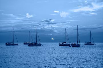 Fototapeta premium Evening view on Yachts, fishing boats and the Adriatic sunset sea, Rovinj, Croatia.