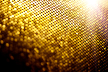 Abstract gold particle background, backdrop with glowing golden dots, hi-tech concept, yellow color screen. Modern mosaic border design. Christmas holiday Widescreen. Backdrops