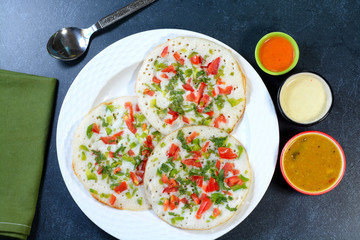 Uttapam is a type of Dosa which is thick and topped with vegetables